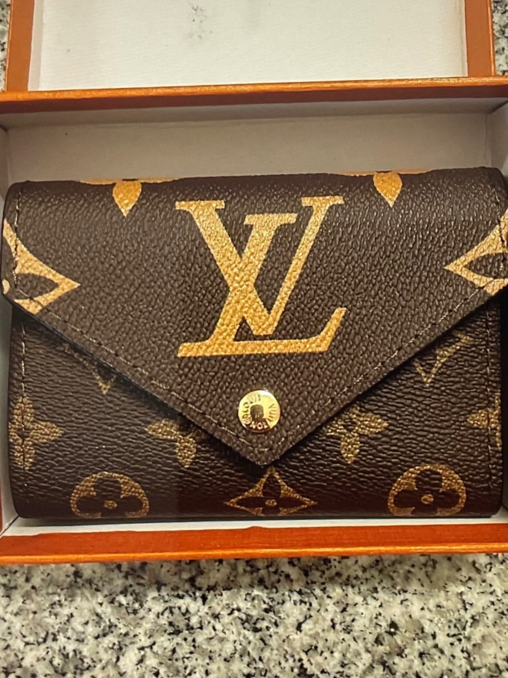 Louis Vuitton Monogram Portefeuille Victorine Tri-fold Wallet.